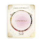 Chakra glow bracelet packaging with 'Confidence' on a pink disc, branded as Scout.