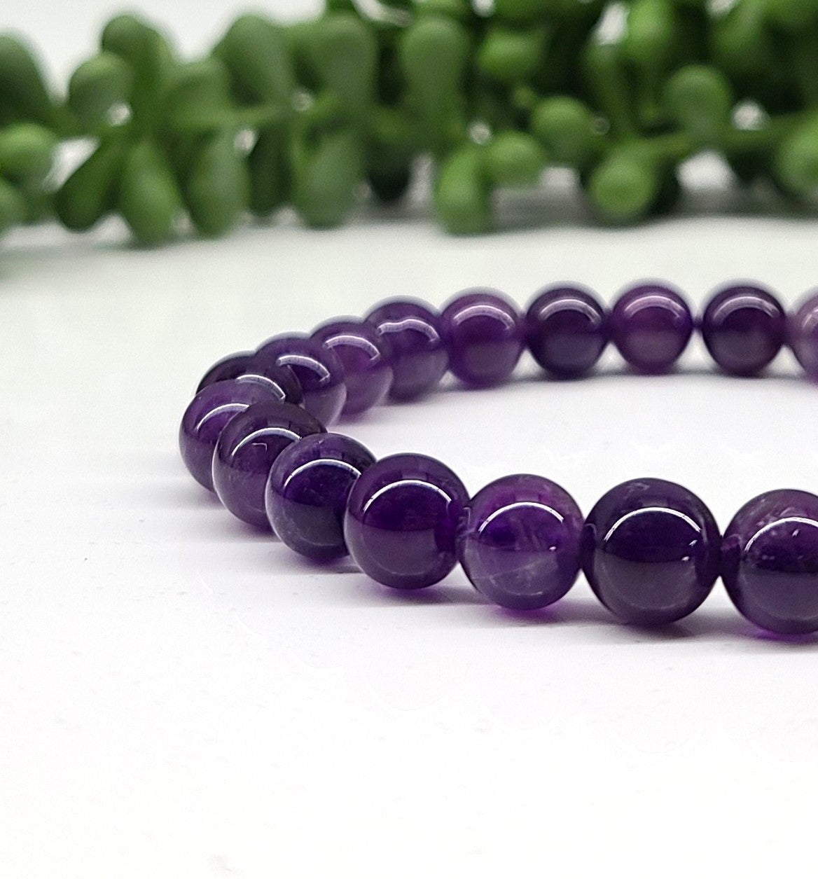 Amethyst 8 mm Smooth Bead Stretch Bracelet closer view