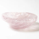 Pink rose quartz bowl on a white background