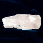 Clear Danburite crystal rock on a dark background