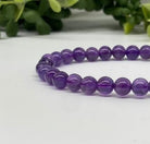 Amethyst 6mm Smooth Bead Stretch Bracelet closer view