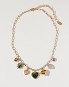 gold and green charm necklace full view 