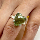 Moldavite Faceted Heart Ring with Sterling Silver on hand