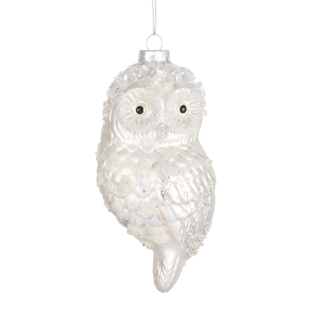 Decorative owl ornament with a white and silver finish on a white background