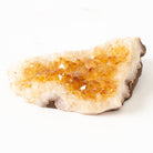 Citrine Crystal rock with a yellowish tint on a white background
