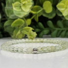 Prehnite 4mm Stretch Bead Bracelet on table