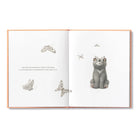 Open book with illustrations of a cat and butterflies on white pages.