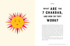 Book page with a colorful sun illustration and text about chakras on a beige background