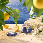 Mediterranean Lemon Mini-tin Candle with ocean background