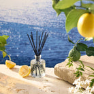 Mediterranean Lemon Reed Diffuser with ocean background
