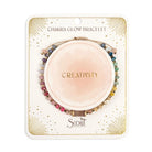 Chakra glow bracelet packaging with 'Creativity' on a white background