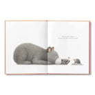 Illustrated book open to two pages showing a large bear and a small mouse.