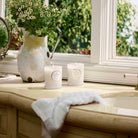 Mountain Lavender and Chamomile Classic Candle 9.5 oz on sink counter