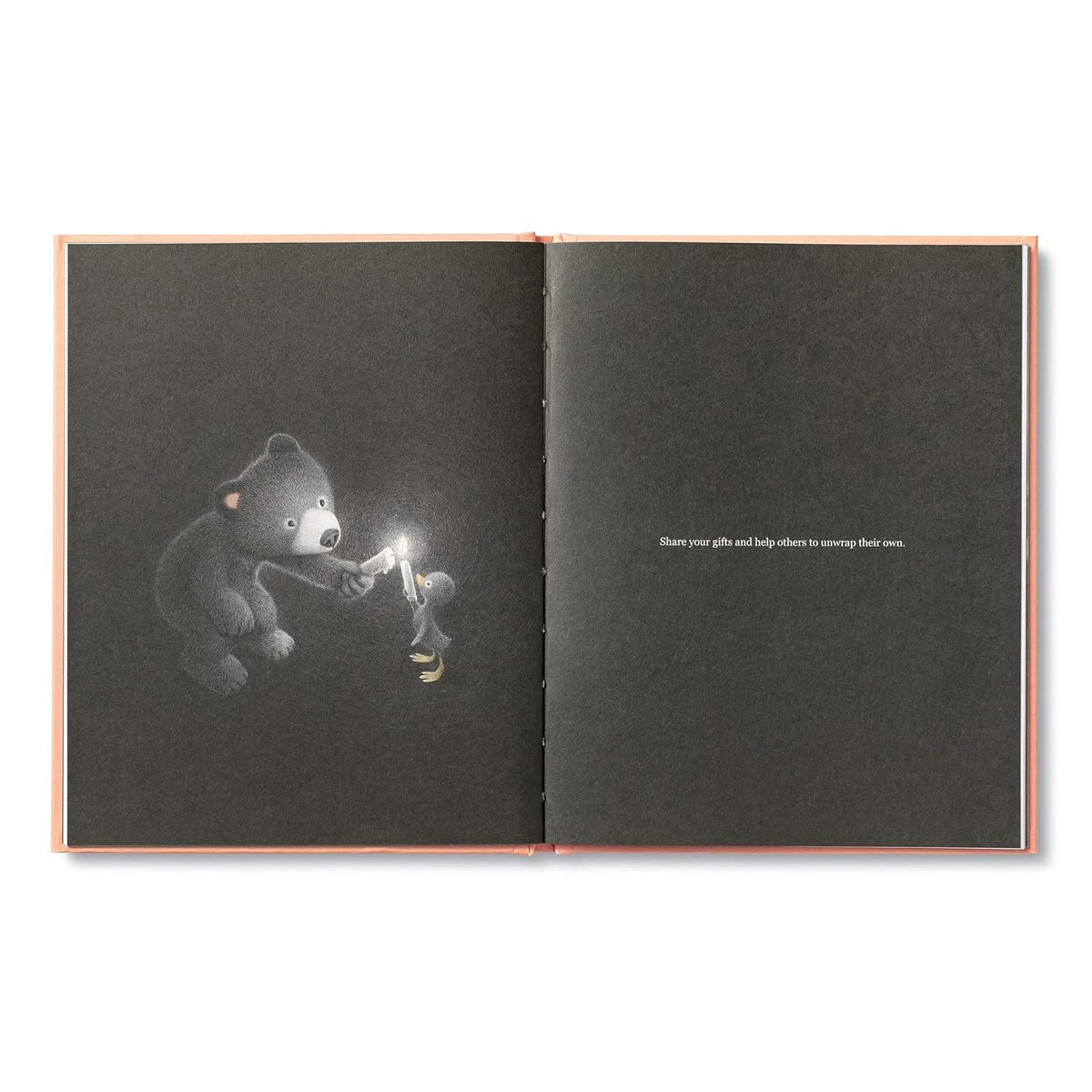 Open book with a bear illustration holding a light bulb on one page and text on the other, on a white background.