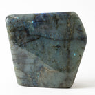 Polished labradorite stone on a white background
