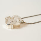 Silver necklace with a unique Herkimer Diamond Stone pendant on a light background