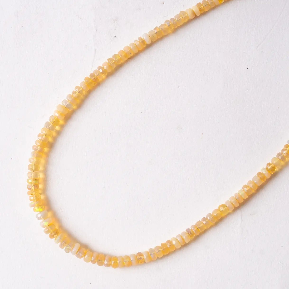 Necklace with Ethiopian Opal  beads on a white background