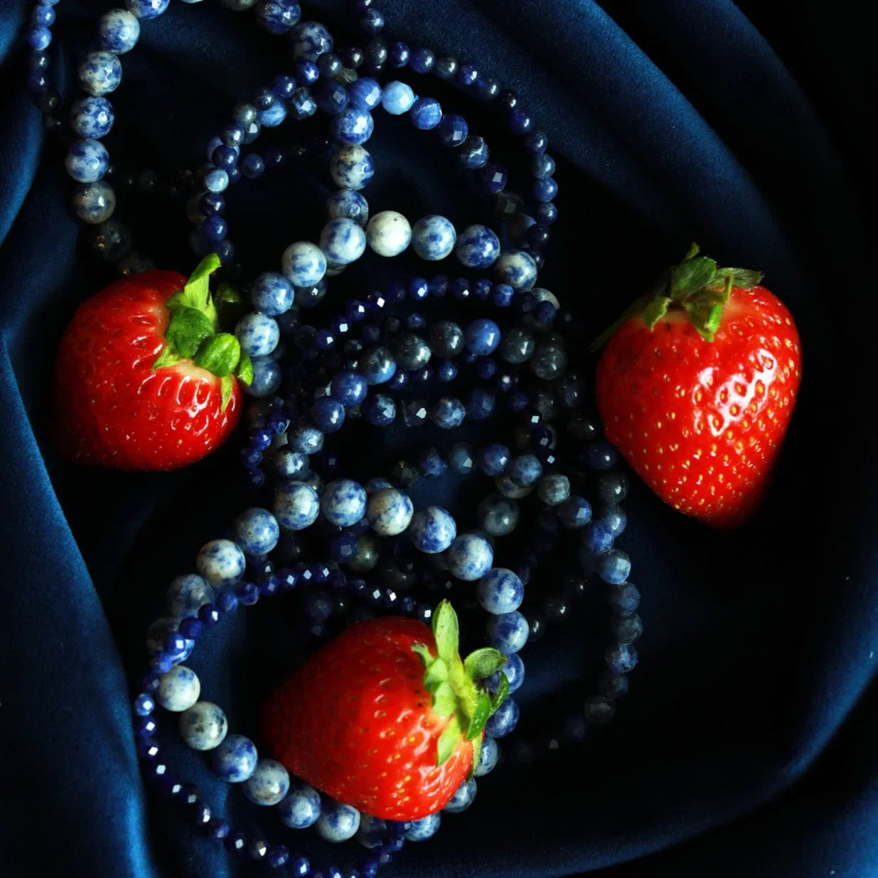 Sodalite Bracelets On Blue Velvet Fabric