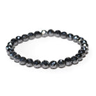 Black faveted hematite beaded bracelet on a white background