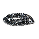 Black hematite beaded bracelets on a white background