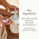 Hand holding a bottle of Thymes product with key ingredients listed on the right.