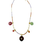 A bohemian-style beaded necklace with a gold-tone clasp and a central dark brown teardrop pendant, featuring dangling round and heart-shaped beads in pink, green, orange, and purple on a white background.