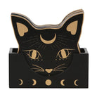 Black cat-shaped notepad holder with gold celestial details, including a crescent moon, sun rays, eyes, whiskers, and moon phases, shown on a white background.