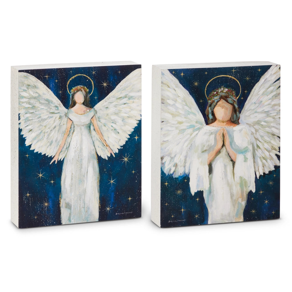 Two square canvas wall art prints showing angel figures with large white wings against a dark blue starry night background, displayed on a white studio background.