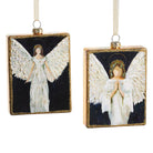 Two angel ornaments with gold frames on a white background