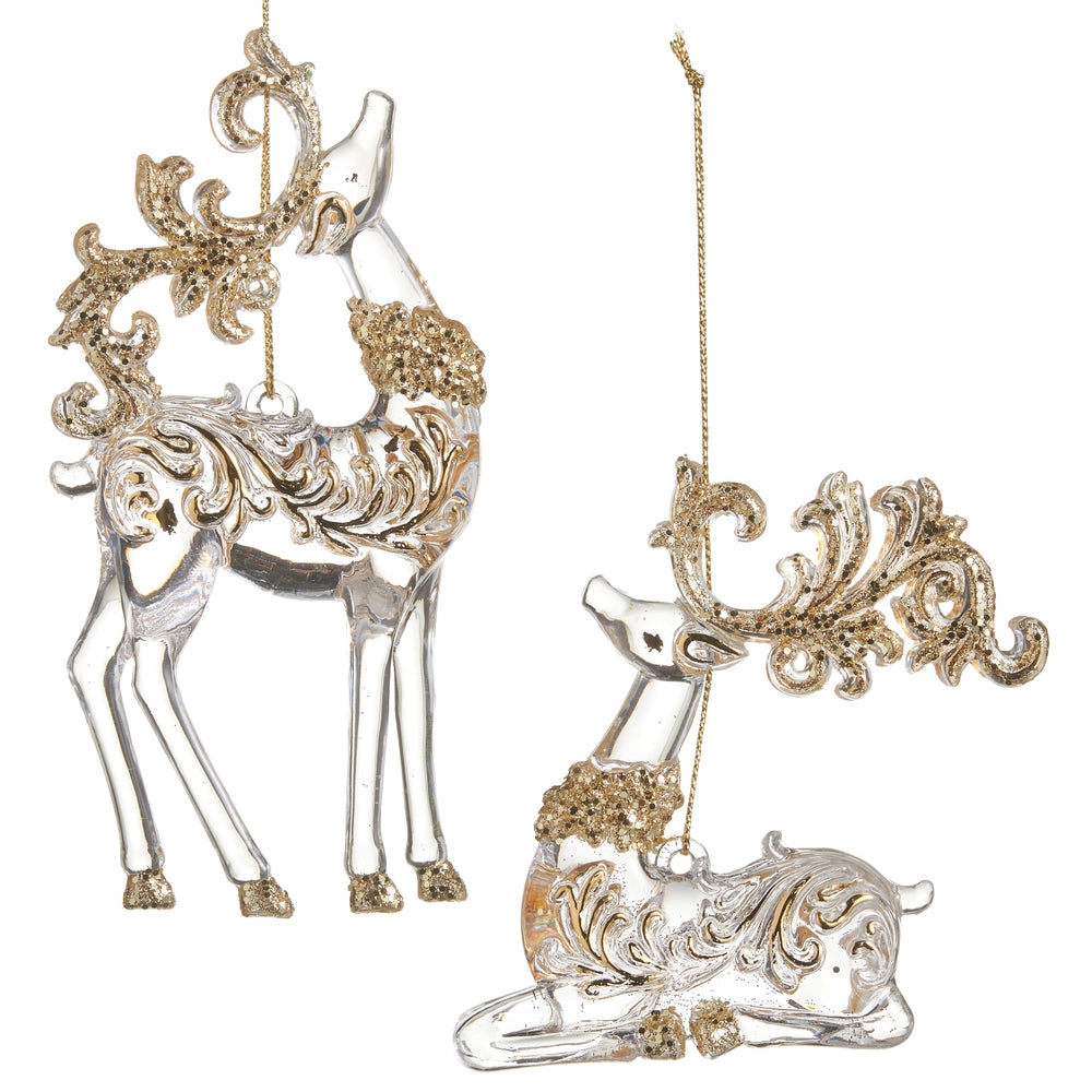Decorative deer ornaments with gold and silver details on a white background