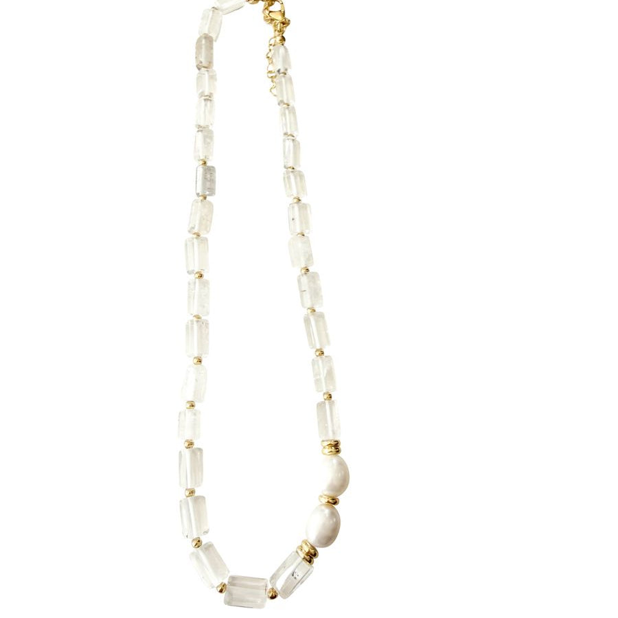 Necklace with snow quartz beads and gold accents on a white background