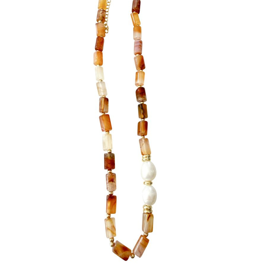 Necklace with carnelian beads on a white background