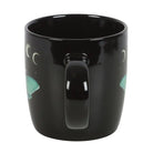 Black mug with designs on a white background
