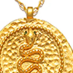 Gold pendant with snake design on a white background