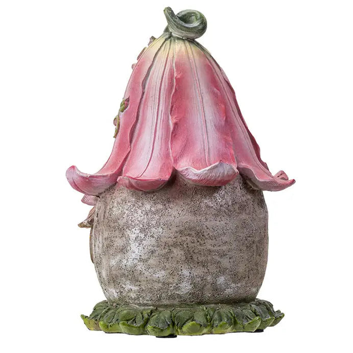 Decorative garden gnome with a pink flower-like hat on a white background