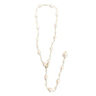 Long pearl necklace on a white background