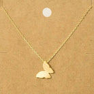 Gold butterfly necklace on a brown card with text