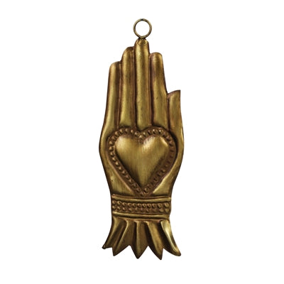 A gold-toned metal wall hanging shaped like a praying hand with a heart motif in the center and a small hanging loop at the top, shown on a plain white background.