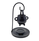 Black cauldron-shaped candle holder on a white background