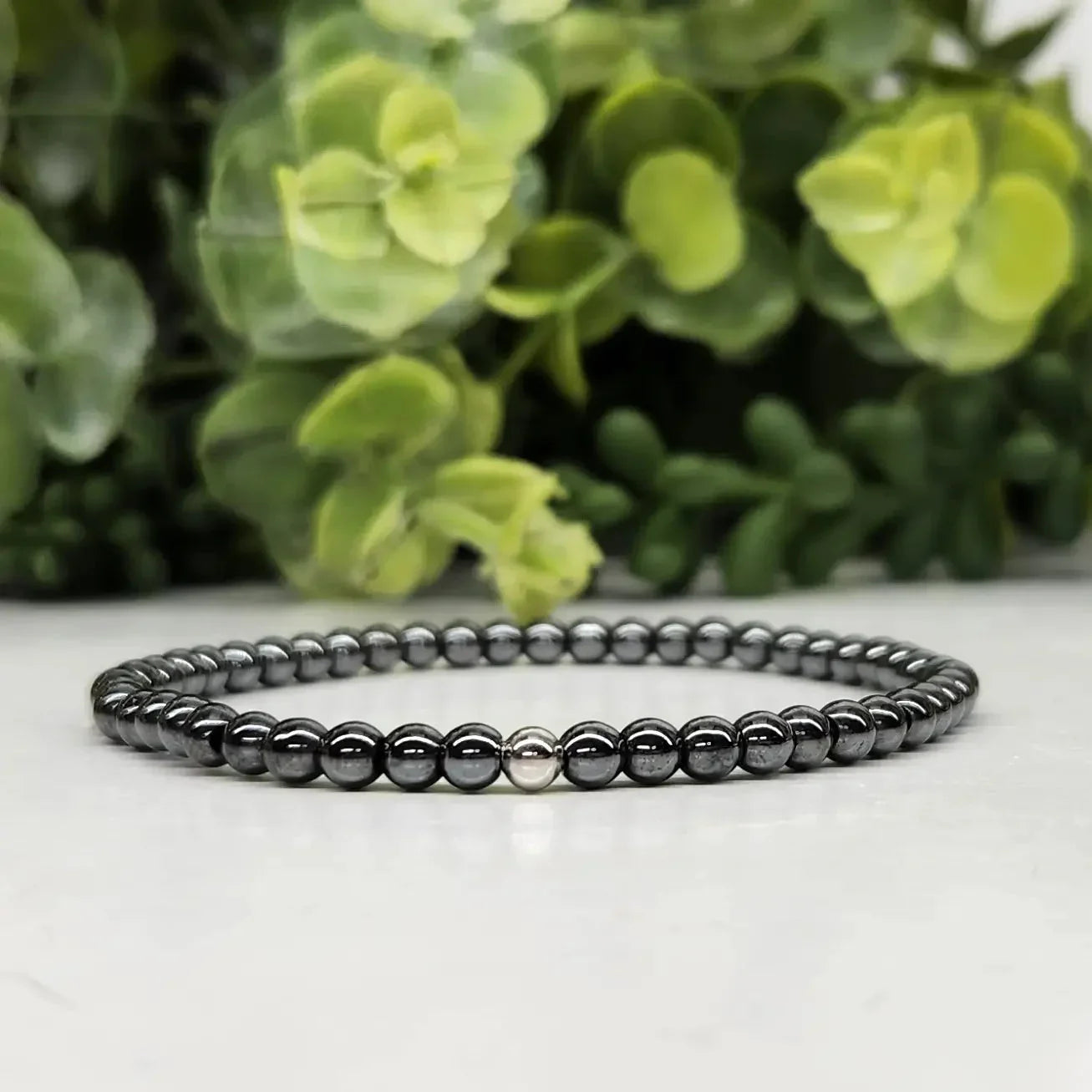 Hematite 4mm Smooth Bead Stretch Bracelet Far View On White