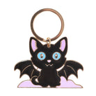 Keychain shaped like a black cat with bat wings on a white background