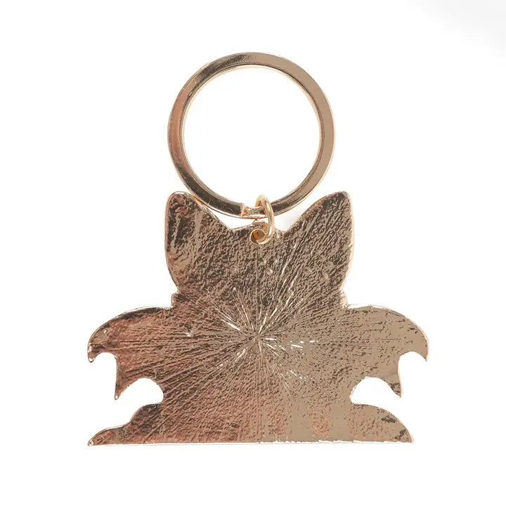 Back of Black Cat with Wings keychain on a white background