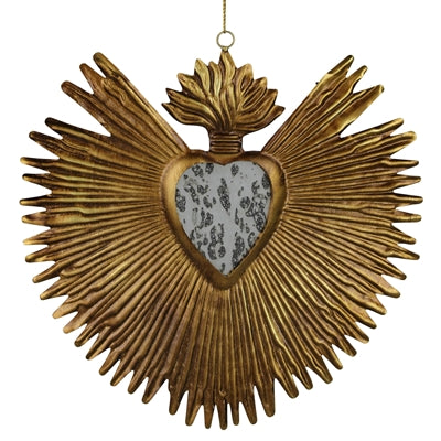 Decorative wall hanging with a heart design and sunburst pattern in gold color.