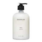 White bottle of Archipelago Milk Hand Wash with black pump on a white background