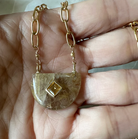 Rutilated Quartz w/ Citrine 18K Gold Vermeil Necklace in hand