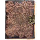 A brown leather journal featuring an embossed owl and leaf design, secured with a brass clasp on the right side, shown against a plain white background.