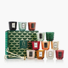 Set of 12 candles in various colors with a decorative box on a white background