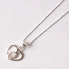 Silver herkimer diamondnecklace with a heart-shaped pendant on a white background
