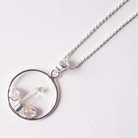 herkimer diamond and quartz Silver necklace with a circular pendant on a white background