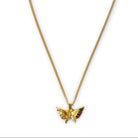Gold butterfly pendant necklace on a white background